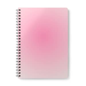 May include: A spiral-bound notebook with a soft pink gradient cover. The colour transitions from a darker pink at the top to a lighter shade at the bottom. The notebook's binding is black.
