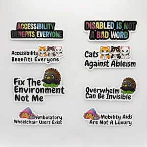 May include: A collection of eight rectangular and die-cut vinyl stickers featuring advocacy messages and illustrations of cats, a bird-like creature, and a snail. The text includes phrases like Accessibility Benefits Everyone, Disabled Is Not A Bad Word, Fix The Environment Not Me, Cats Against Ableism, Overwhelm Can Be Invisible, Ambulatory Wheelchair Users Exist, and Mobility Aids Are Not A Luxury.