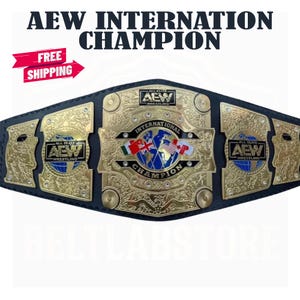 May include: A black leather championship belt featuring a large central gold plate with an engraved world map, the text INTERNATIONAL CHAMPION, and several national flags. The belt includes two side plates with the AEW WRESTLING logo in gold.