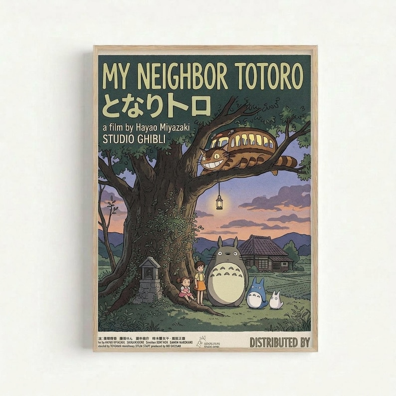 A framed vintage-style poster featuring characters from My Neighbor Totoro under a large tree at twilight. The artwork shows Totoro and smaller forest spirits with two children beside a massive tree trunk, while the Cat Bus perches in the branches above. A traditional Japanese house sits in the background under a purple-orange sunset sky. The poster has a dark green background with cream text reading "MY NEIGHBOR TOTORO" and Japanese characters, along with "a film by Hayao Miyazaki STUDIO GHIBLI