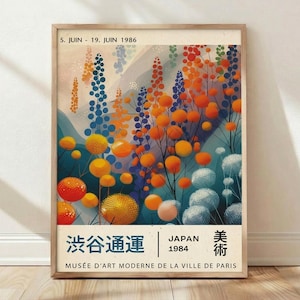 May include: Framed art print featuring a colorful floral design with orange, blue, and yellow spherical shapes and vertical elements. The print includes Japanese text and the text "JAPAN 1984". The artwork is displayed in a wooden frame.