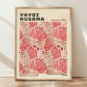 May include: Framed art print featuring a pattern of pink and red floral shapes and dots. The print includes the text "YAYOI KUSAMA" and "INFINITY SHELL" at the top, with Japanese text and "NATIONAL MUSEUM OF MODERN ART IN TOKYO" at the bottom.
