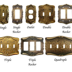 May include: A collection of antique brass-colored switch plates in various configurations: single, single rocker, outlet, double, double rocker, triple, triple rocker, and quadruple. Each plate has a textured surface and decorative edges, with labels below.