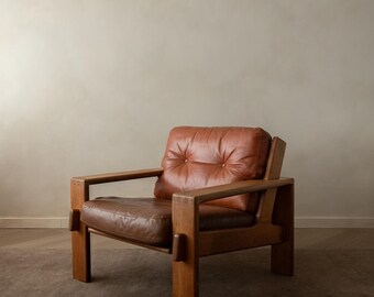 Sillón Bonanza vintage de roble y cuero color coñac, de Esko Pajamies para Asko, década de 1960.