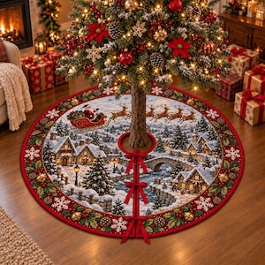 May include: A round Christmas tree skirt featuring a winter village scene with snow-covered houses, a stone bridge, and a river. The border is red with holly leaves, berries, and gold bells. Three red ribbon ties secure the skirt around the tree.