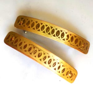 Small brass hair barrettes. Pair of hand etched metal hair barrettes with overlapping circles pattern on antiqued yellow brass.