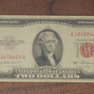 May include: A rustic wooden sign with the text "Welcome to our home" in a handwritten style. The sign features a distressed finish and a simple, inviting design, perfect for a front porch or entryway.