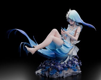 May include: A detailed anime-style figurine of a character with short blue hair wearing a light blue hooded garment and a matching dress. The figure is seated on a base decorated with dark blue flowers and foliage, with a flowing blue fabric element.