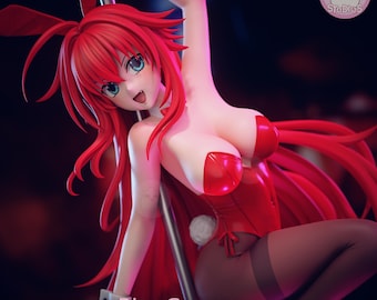 May include: A Rias Gremory anime-style figurine featuring long red hair, blue eyes, and a red bunny-themed bodysuit with a white collar and cuffs. The character is posed against a silver pole, wearing black tights and a white tail, with the text Rias Gremory.