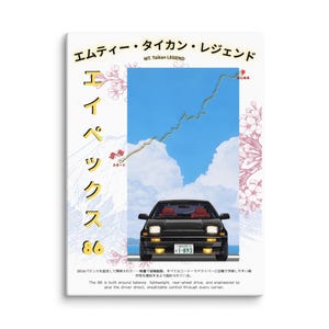 May include: A canvas print featuring a black sports car with red interior, set against a blue sky with a winding road graphic. Japanese text and cherry blossom illustrations frame the car. The text reads "MT. Taikan LEGEND" and "86".