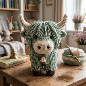 May include: A white ceramic mug with a black handle and the text "But First, Coffee" in a bold, black font. The mug is filled with a dark liquid, likely coffee, and sits on a light-colored surface.