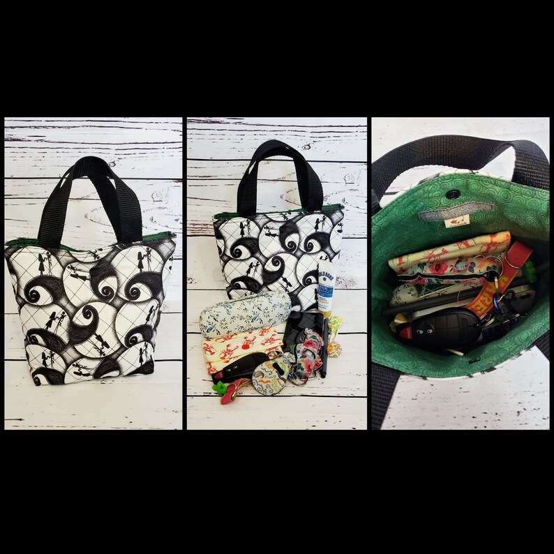 May include: A black and white tote bag with a green lining. The bag has a repeating pattern of Jack Skellington's face from the Nightmare Before Christmas. The bag is shown open with various items inside, including a small bottle of hand sanitizer, a pair of glasses, and a few keys.