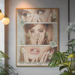 May include: A framed poster with a gold frame, displaying a triptych of a woman's face. The poster includes the text "heave sent", "you to me", and "ariana grande 2023". The image has floral accents. The poster is a decorative item.
