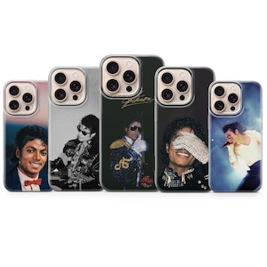 May include: Five phone cases showcasing images of Michael Jackson. The cases feature different portraits of the singer, including a black and white photograph and a colour image with a red bow tie. The cases have a clear border.