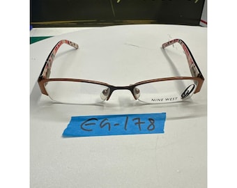 Montura de gafas Nine West NW145 RX5 125 de metal marrón con media montura.