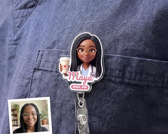 May include: A custom badge reel featuring a cartoon illustration of a person with long dark hair, glasses, and a white medical coat holding a coffee cup. The name Maya is printed in pink script above the text BSN, RN on a white background.