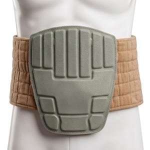 May include: A tan-colored back support belt with a gray, padded central panel. The belt has a quilted texture and is designed to provide support and protection. The central panel has a geometric design.