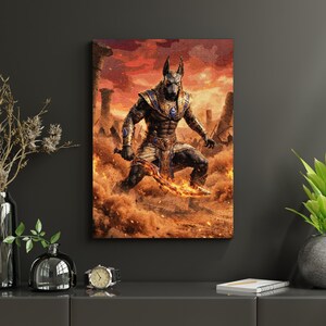 May include: A canvas print featuring Anubis, the jackal-headed deity, in a dynamic pose. The artwork shows Anubis with a glowing sword, set against a fiery, desert-like backdrop. The colour palette includes shades of gold, blue, and brown.