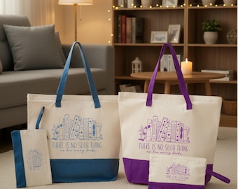 May include: Two canvas tote bags and two matching zippered pouches. One set features blue accents and the other purple. Each item displays a line art illustration of a row of books and the text "THERE IS NO SUCH THING as too many books."