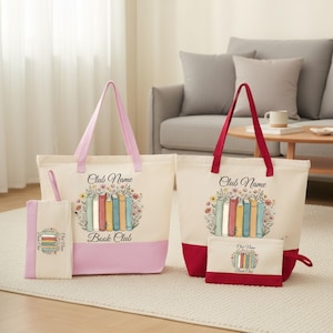Two tote bags with the text "Book Club" printed on them, along with illustrations of books, are placed on a white rug in a living room setting.