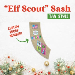 May include: Tan colored "Elf Scout" sash with a custom troop number, a snowman, a Christmas tree, and other holiday-themed patches.