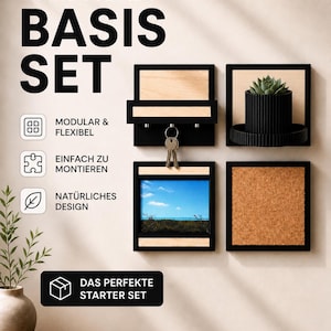 Könnte beinhalten: Ein modulares Wandaufbewahrungssystem mit schwarzen Rahmen und Akzenten aus Naturholz. Das Set enthält einen Schlüsselhalter, ein kleines Regal mit einer Pflanze, einen Bilderrahmen und eine Pinnwand. Der Text auf dem Bild lautet "WANDSYSTEM BASIS SET".