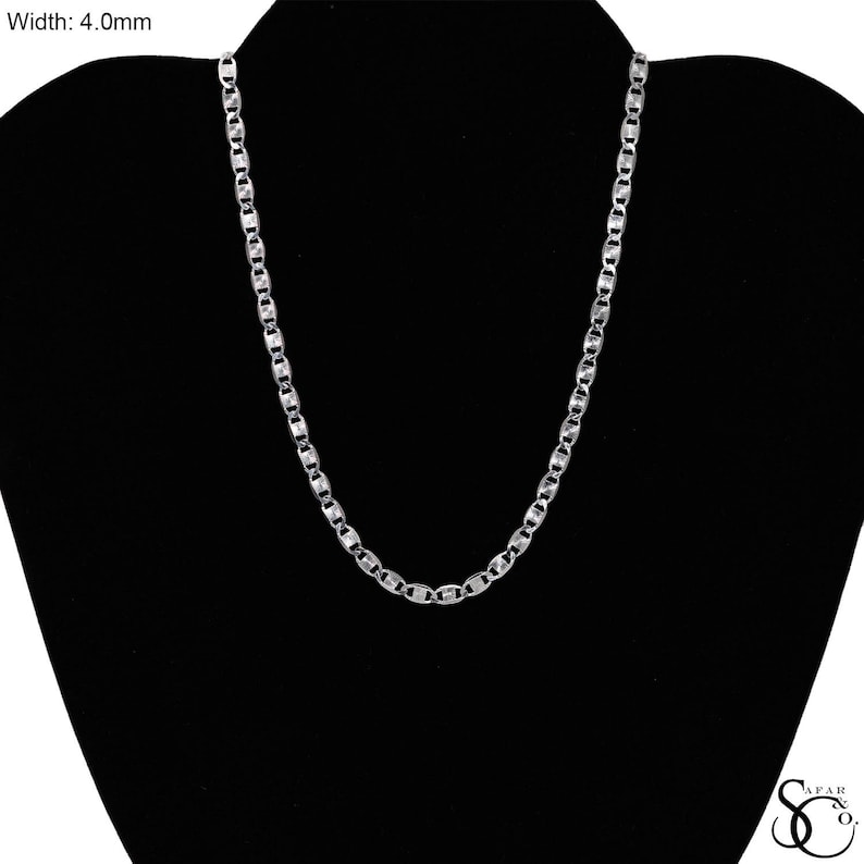 May include: A silver-colored chain necklace with a 4.0mm width, displayed against a black background. The chain features a series of interconnected, elongated oval links. The necklace is presented on a black mannequin, showcasing its design and style.