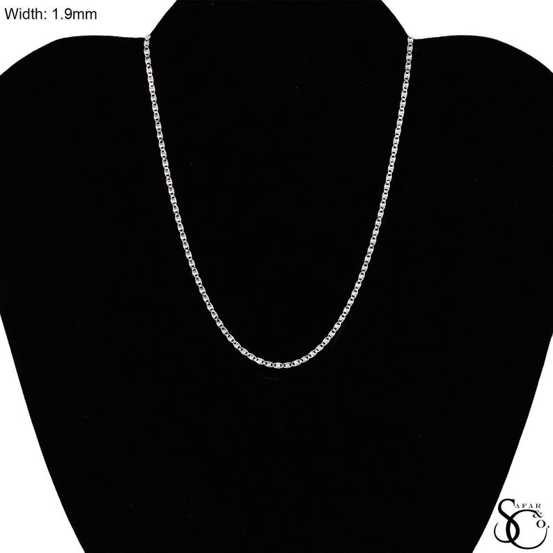 May include: A silver-colored chain necklace with a box link design, displayed on a black mannequin. The chain's width is 1.9mm.