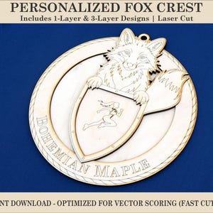 May include: A laser-cut wooden fox crest with the text "PERSONALIZED FOX CREST" at the top. The crest features a fox holding a shield with a running figure. The words "BOHEMIAN MAPLE" are inscribed on the crest. The text "INSTANT DOWNLOAD - OPTIMIZED FOR VECTOR SCORING (FAST CUTTING)" is at the bottom.