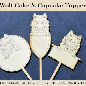 May include: Three light-colored wooden cake and cupcake toppers featuring laser-cut wolf designs. Each topper displays a wolf head with paws resting on a different shape: a circle, a shield, and a rectangular banner, all attached to thin wooden sticks.