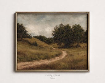 May include: A framed landscape painting featuring a dirt path winding through a grassy field toward a cluster of dark green trees under a cloudy sky. The artwork is enclosed in a thin metallic gold frame and includes the text Antique Mist Prints.