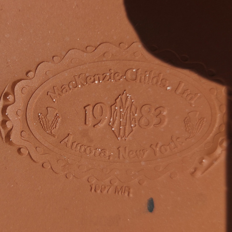 May include: A set of three ceramic mugs with a speckled, matte finish. The mugs are in shades of cream, light gray, and dark gray. Each mug has a simple, minimalist design, perfect for coffee or tea.