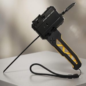 May include: A black and yellow Beyblade X Winder Launcher with a long black ripcord, a black wrist strap, and a rectangular body featuring the text Beyblade X Winder Launcher. A silver plaque on the base reads Beyblade X Series - Accessory No. X-01.