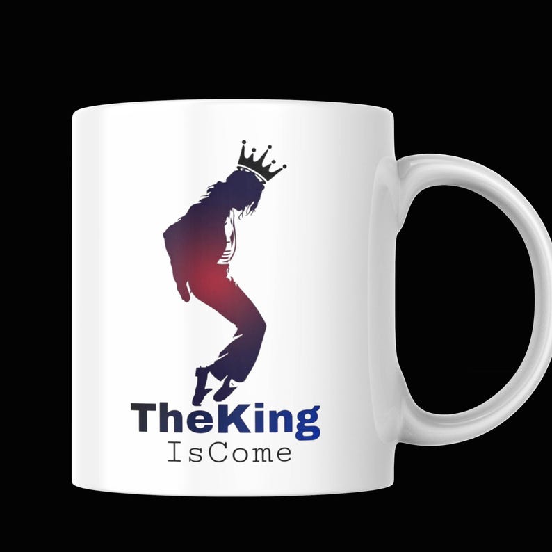 May include: White ceramic mug featuring a silhouette of a person wearing a crown, in a dance pose. The silhouette is filled with red and blue gradients. Below the silhouette is the text "The King Is Come" in blue and black.