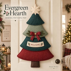 May include: A hanging fabric Christmas tree decoration featuring four layered segments in dark green, light green, and red. It includes a cream-colored star topper, a red bow, and a cream banner with the text "WELCOME" and small leaf accents.