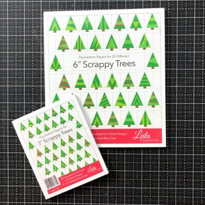 May include: Two white paper booklets titled Foundation Papers for 6" Scrappy Trees and 3" Scrappy Trees by Leila Gardunia. Each cover features a grid of various green and red geometric Christmas tree illustrations on a white background.