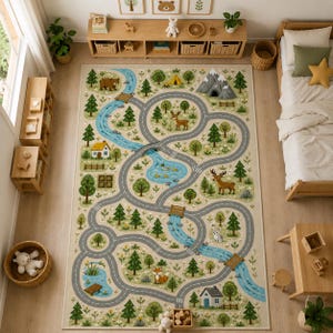 May include: A rectangular area rug featuring a printed forest landscape with a winding gray road, a blue river, green trees, and various wildlife including a bear, deer, and fox. The design includes small houses, mountains, and wooden bridges.