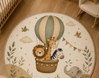May include: A round area rug featuring a whimsical illustration of a lion, giraffe, and zebra riding in a hot air balloon. The design includes a gray elephant, a turtle, birds, clouds, stars, and bunting flags in muted earth tones on a cream background.