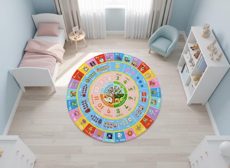 May include: A circular educational area rug featuring a colorful design with the alphabet, numbers one through twelve, months of the year, and seasonal illustrations. The rug displays letters from A to Z, counting graphics, and a central tree motif.