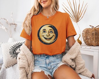 Smiling Moon Face Graphic T-Shirt, Whimsical Artwork, Bold Lines, Print-Ready