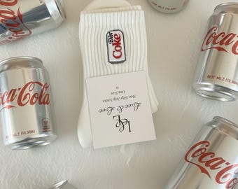 Coke-geborduurde gripsokken