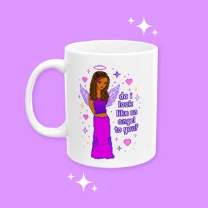 May include: White ceramic mug featuring a pixelated illustration of a woman with angel wings, a halo, and the text "do i look like an angel to you?" The design includes hearts and stars in pink, purple, and yellow.