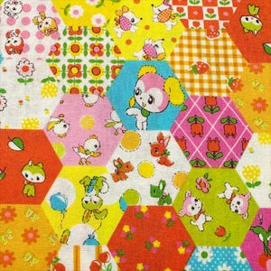 May include: A colorful patchwork fabric featuring a repeating pattern of hexagonal shapes. Each hexagon contains a different design, including cartoon animals, flowers, and geometric patterns in shades of pink, yellow, orange, and blue.