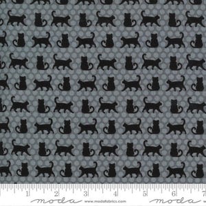 May include: A fabric with a repeating pattern of black cat silhouettes on a gray background with white polka dots. The cats are in various poses, including standing and walking. The fabric is measured in inches.