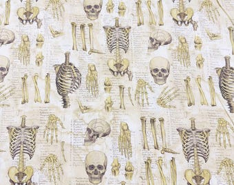 May include: A beige fabric with a repeating pattern of anatomical illustrations of human skeletons, bones, and skulls. The illustrations are in a vintage style and are printed in shades of brown and yellow.