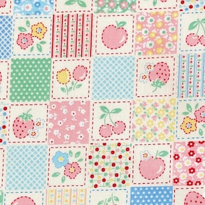 May include: A fabric pattern featuring a grid of squares with various designs including pink apples, red cherries, strawberries, and small flowers in yellow, blue, and pink. The squares are separated by dashed lines and include polka dots and stripes.