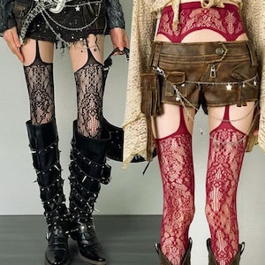 May include: Black lace thigh-high stockings and burgundy lace thigh-high stockings. The stockings are held up by garters. The black stockings are paired with black boots with silver spikes. The burgundy stockings are paired with brown shorts.