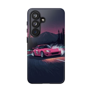 May include: A phone case featuring a pink sports car racing on a dark road with a mountain backdrop. The car has the number 34 on the side. The background has a purple and blue color scheme.