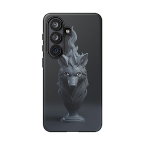 May include: A black phone case featuring a gray wolf sculpture with fiery details. The wolf has glowing white eyes and is set against a dark gray background. The case has a camera module on the side.