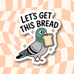 May include: A die-cut sticker featuring a cartoon pigeon with grey and teal feathers holding a slice of bread in its beak. Above the bird, the text reads LET'S GET THIS BREAD in bold black capital letters, accented by four small yellow stars.
